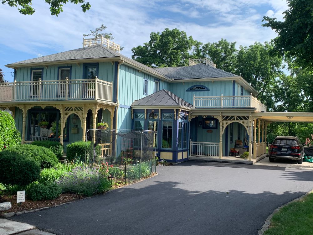 victorian home with paved driveway